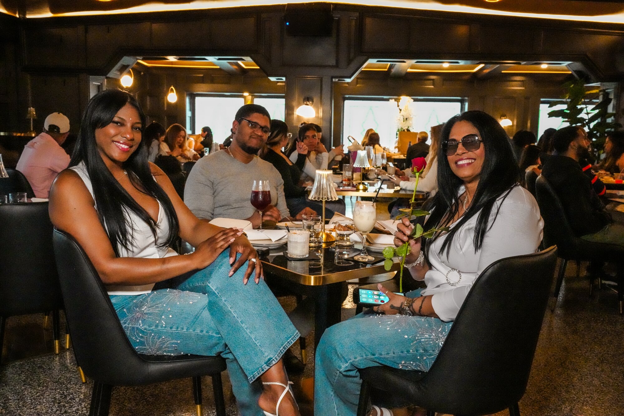 Guests celebrating with roses at brunch