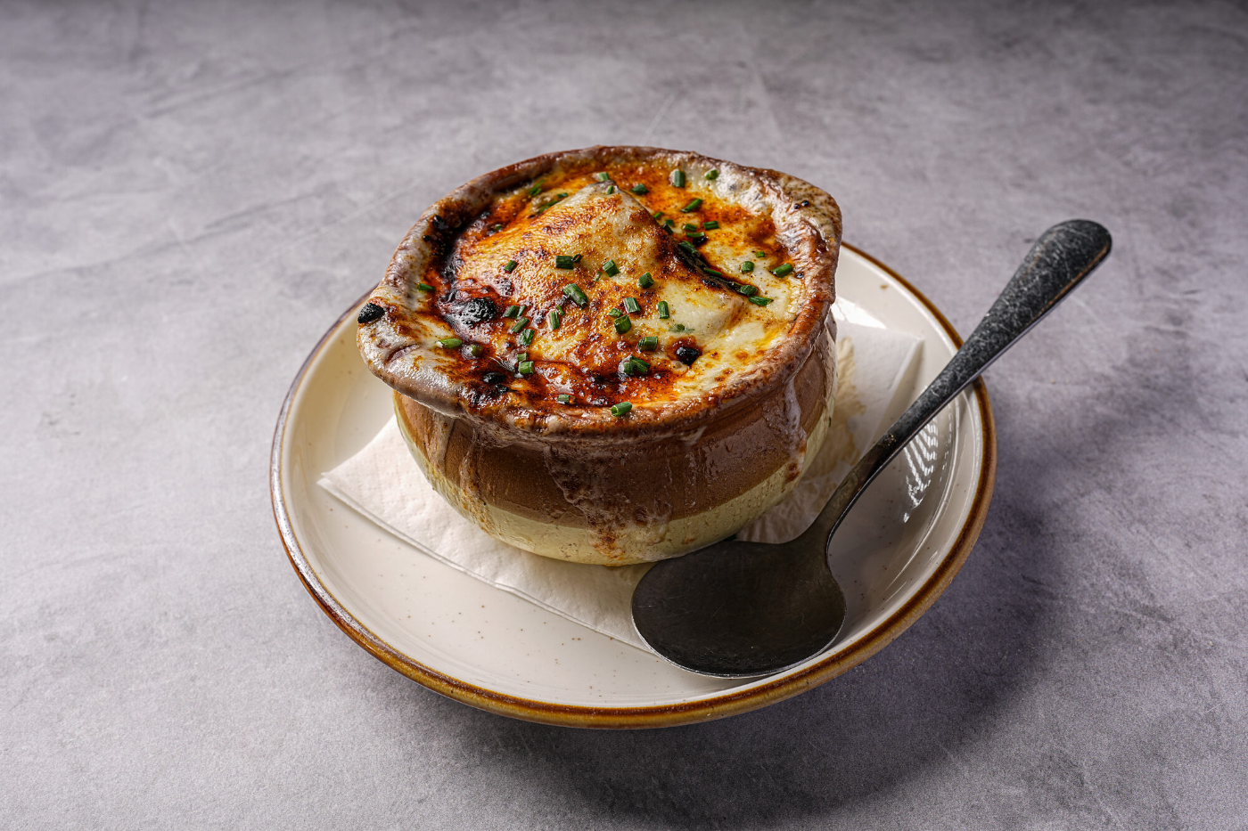 Classic French onion soup baked with melted cheese